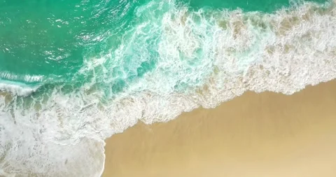 Blue waves at the beach aerial view form drone camera high quality Stock Footage 311592779