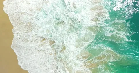 Blue waves at the beach aerial view form drone camera high quality Stock Footage 311593033