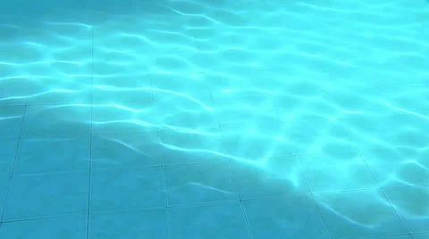 Blue waves on the bottom of a pool Stock Footage 23588666