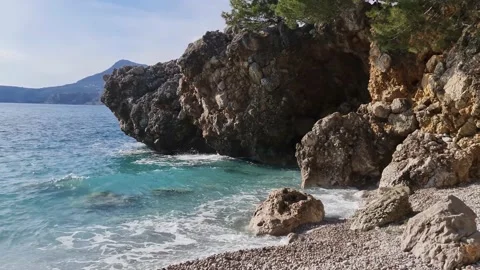 Blue waves breaking on the rocks Stock Footage 183822718