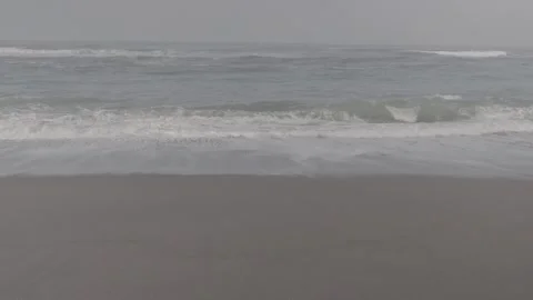 Blue waves on a clean beach Stock Footage 316574402