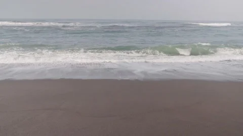 Blue waves on a clean beach Stock Footage 316574404