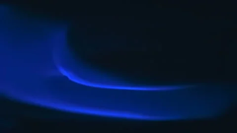 Blue waves of flame move slowly on a black background Stock Footage 130540027