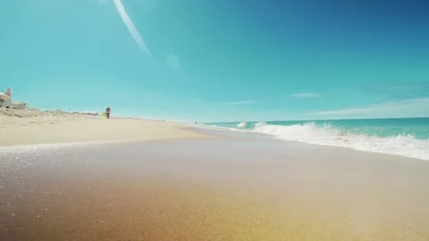 Blue waves on the ocean, yellow sand Stock Footage 131388095