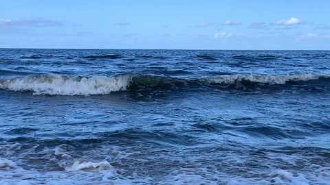 Blue waves roll into the coast. Stock Footage 116664383