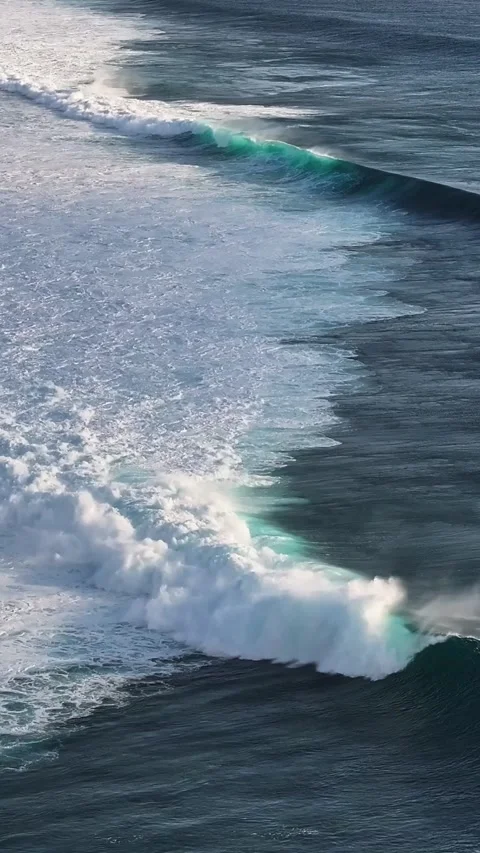 Blue Waves Rolling with Energy Across Open Sea Stock Footage 335197654