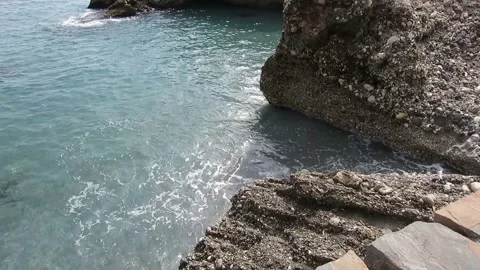 Blue waves splash on the rocks2 Stock Footage 160754074