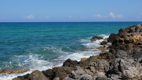 Blue waves at Volcanic rocky shore, Crete summer holidays Stock Footage 100373788