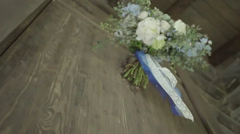 Blue wedding bouquet develops on the background of wooden wall Stock Footage 58279199