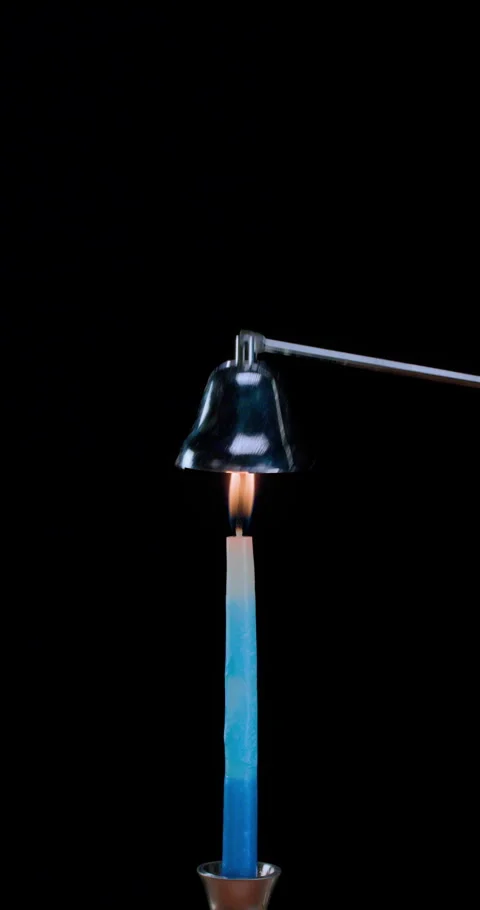 Blue &amp; White lit candle, snuffed out flame, dissipating smoke (Vertical 8K) Stock Footage 327865703
