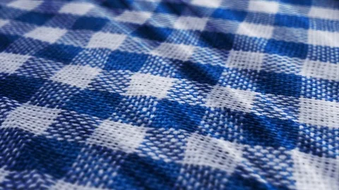 Blue white tablecloth, picnic gingham is waving. Video stock 108470322