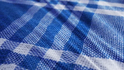 Blue white tablecloth, picnic gingham is waving. Video stock 108470344