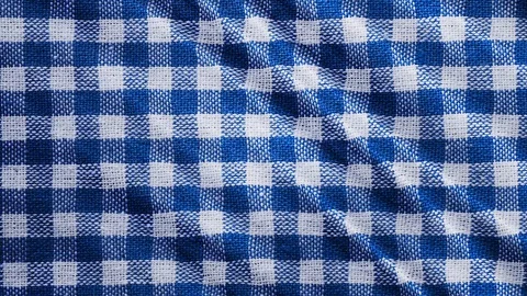 Blue white tablecloth, picnic gingham is waving. Video stock 108470413