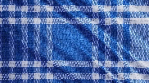 Blue white tablecloth, picnic gingham is waving. Video stock 108470593