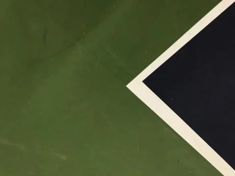 Blue, white triangle shape and green surface at the right side of tennis court Stock Photos
