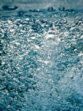 Blue white water bubbles in a pool Stock Photos