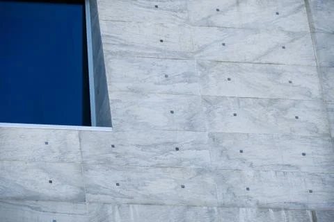 Blue window on a big gray facade Foto stock
