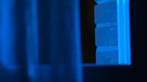 Blue window with light coming throw. Blue light. Stock Photos