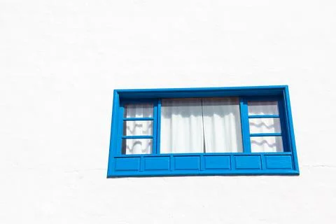 Blue window at white wall Stock Photos