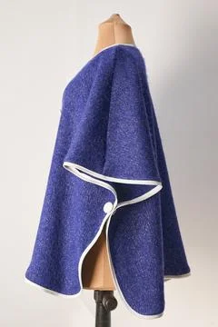 Blue wool poncho with white applications. women's formal wear. 스톡 사진