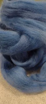Blue wool roving texture loosely coiled fiber stash Stock Photos