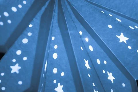 Blue xmas lantern star pattern at christmas market season. Shiny star mood la Stock Photos