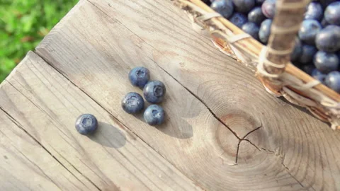 Blueberrie fall on a wooden table Stock Footage 114605457