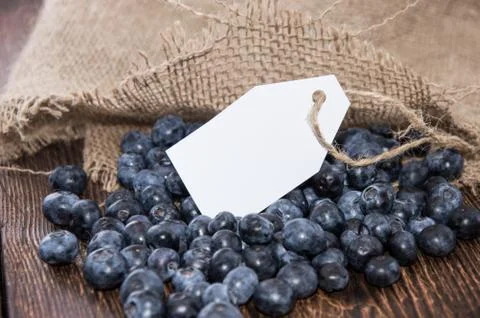 Blueberries with empty tag Stock Photos