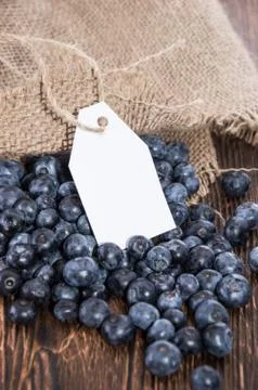Blueberries with empty tag Stock Photos