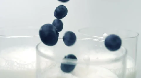 Blueberries falling into a glass Stock Footage 61249250