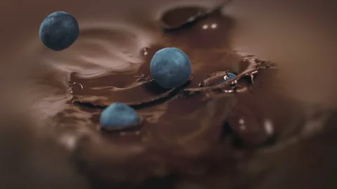 Blueberries Falling Into Liquid Chocolate in 4K Super slow motion Stock Footage 139446076
