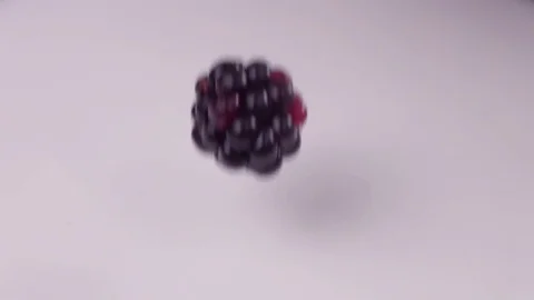 Blueberries falling into milk in slow motion. Blueberries falls into Yogurt in Stock Footage 79050749
