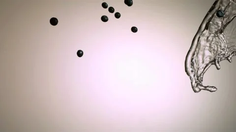 Blueberries flying through splash of clear water Stock Footage 327180389