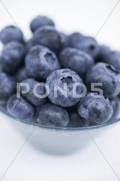 Blueberries in glass dish Stock Photos