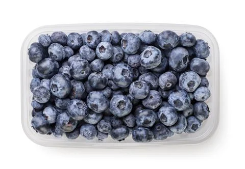 Blueberries in a plastic box on a white background. Top view Foto stock