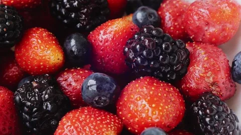 With blueberries in a plate are rotating in a circle Stock Footage 287621023