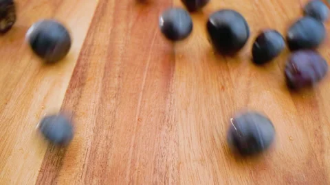 Blueberries Rolling Down a Cutting Board Stock Footage 156053816