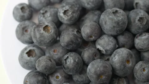 Blueberries rotating on clean background represent antioxidant rich superfood Video stock 332874833