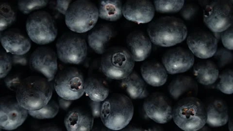 Blueberries rotating loop fresh produce fruit blue overhead close up dark Stock Footage 138788888