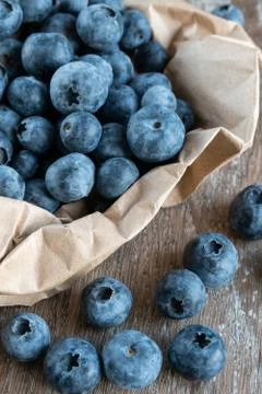 Blueberries on rustic background close-up Stock Photos