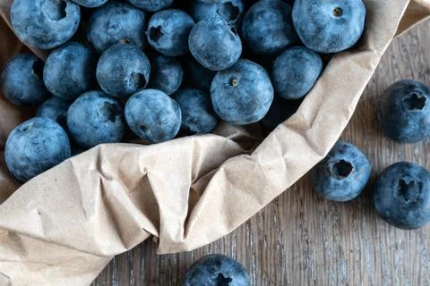 Blueberries on rustic background close-up Stock Photos