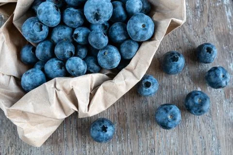 Blueberries on rustic background close-up Stock Photos