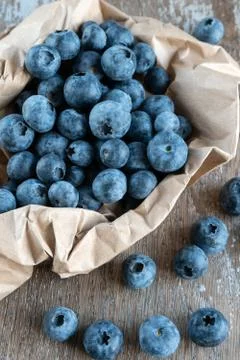 Blueberries on rustic background close-up Stock Photos