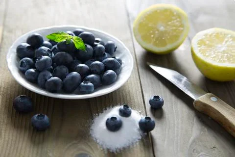 Blueberries on rustic table Stock Photos