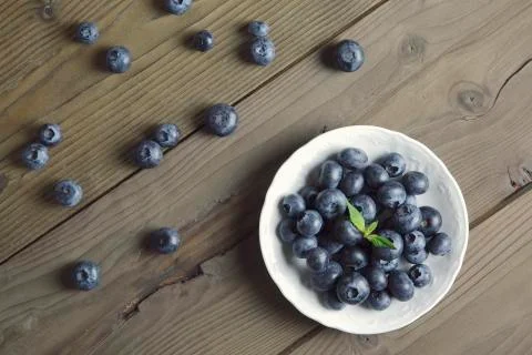 Blueberries on rustic table Stock Photos
