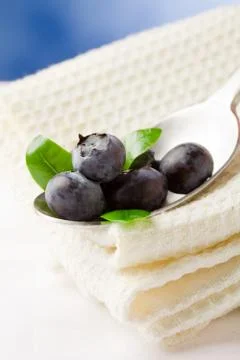 Blueberries on spoon Stock Photos