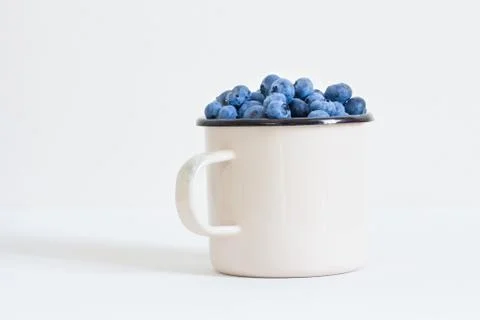 Blueberries in white cup Stock Photos