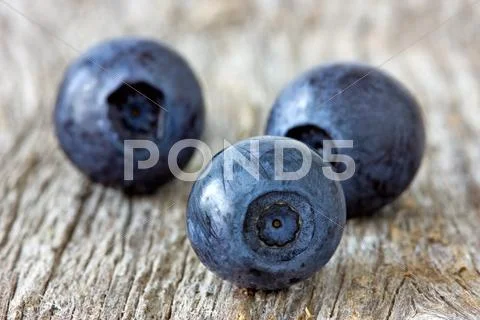 Blueberries on wooden background Stock Photos