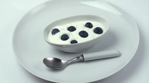 Blueberries yogurt on white Stock Footage 107320029