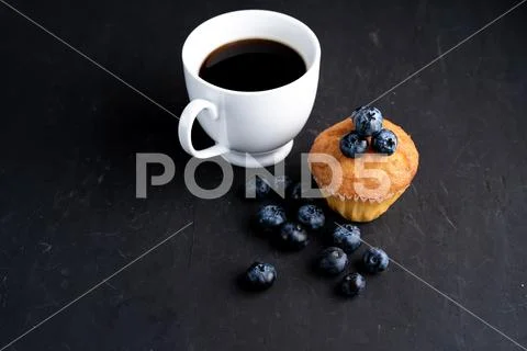 Blueberry antioxidant organic superfood and sweet muffin with cup of coffe Co Stock Photos